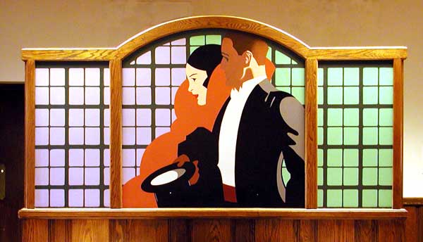 mural painted in an art deco style featuring a man and woman formally dressed